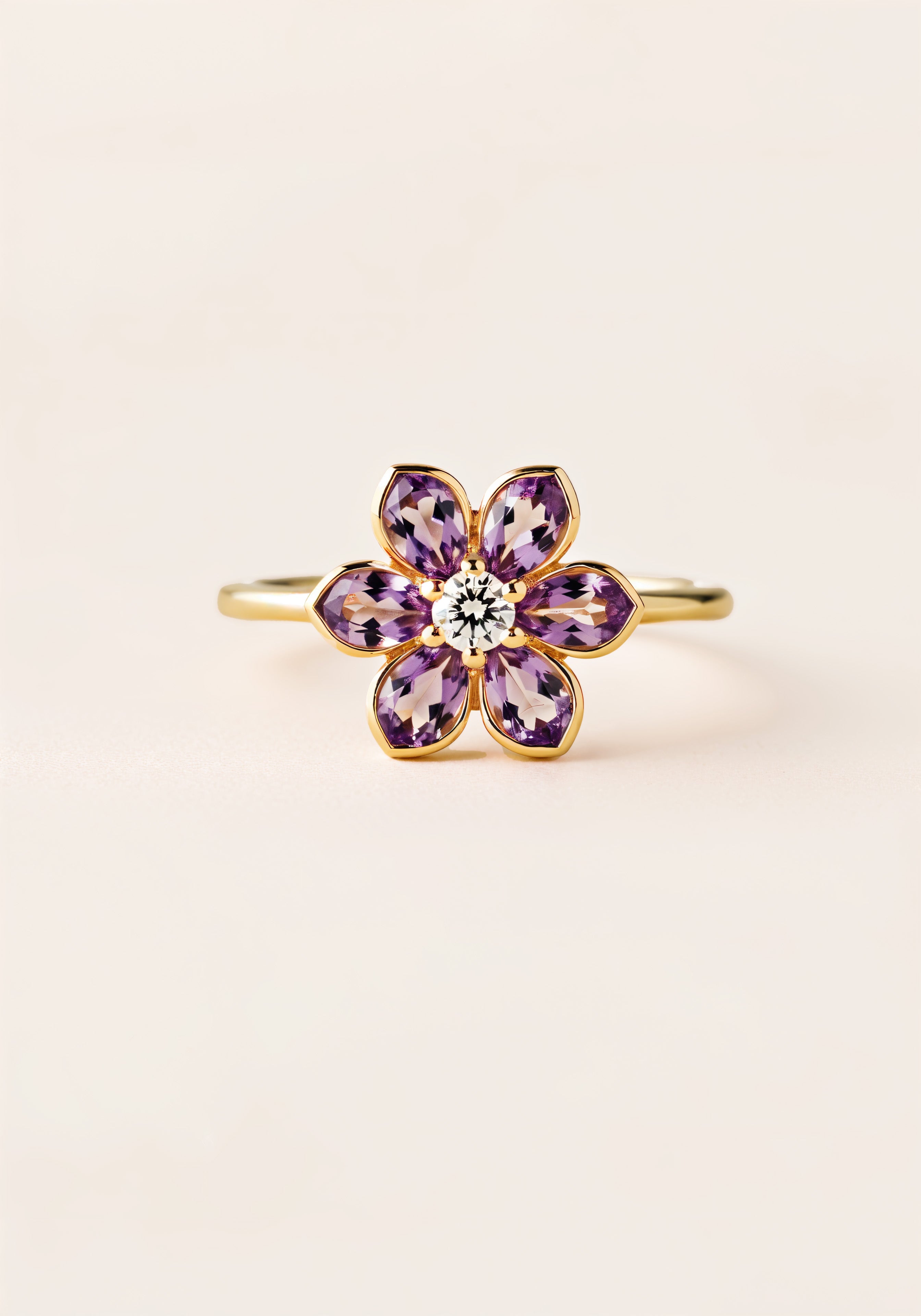 A gold ring with a six-petaled amathyst flower, with a white diamond in thecenter.