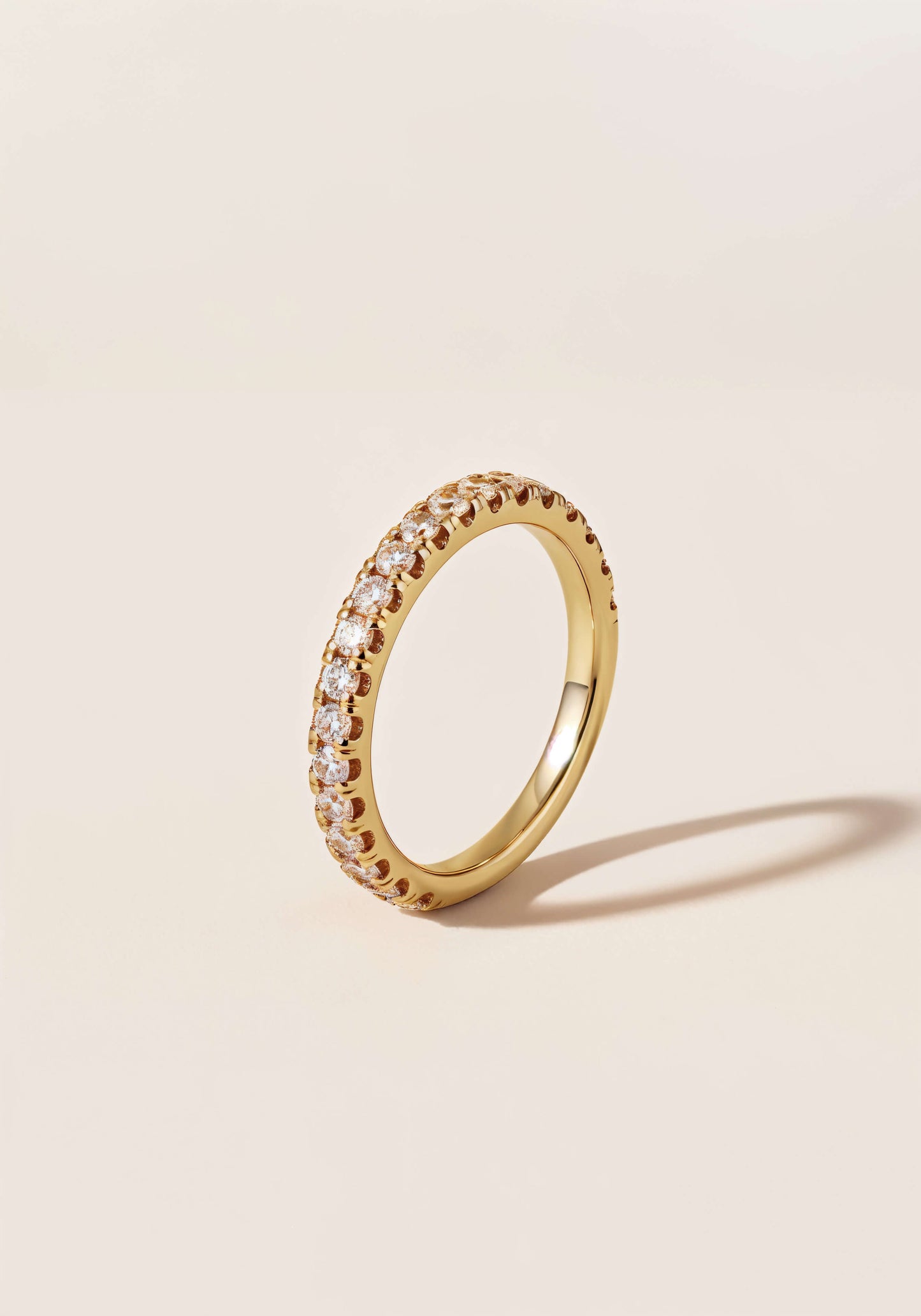 A gold ring  with mini-diamonds encrusted all the way around the circumference.