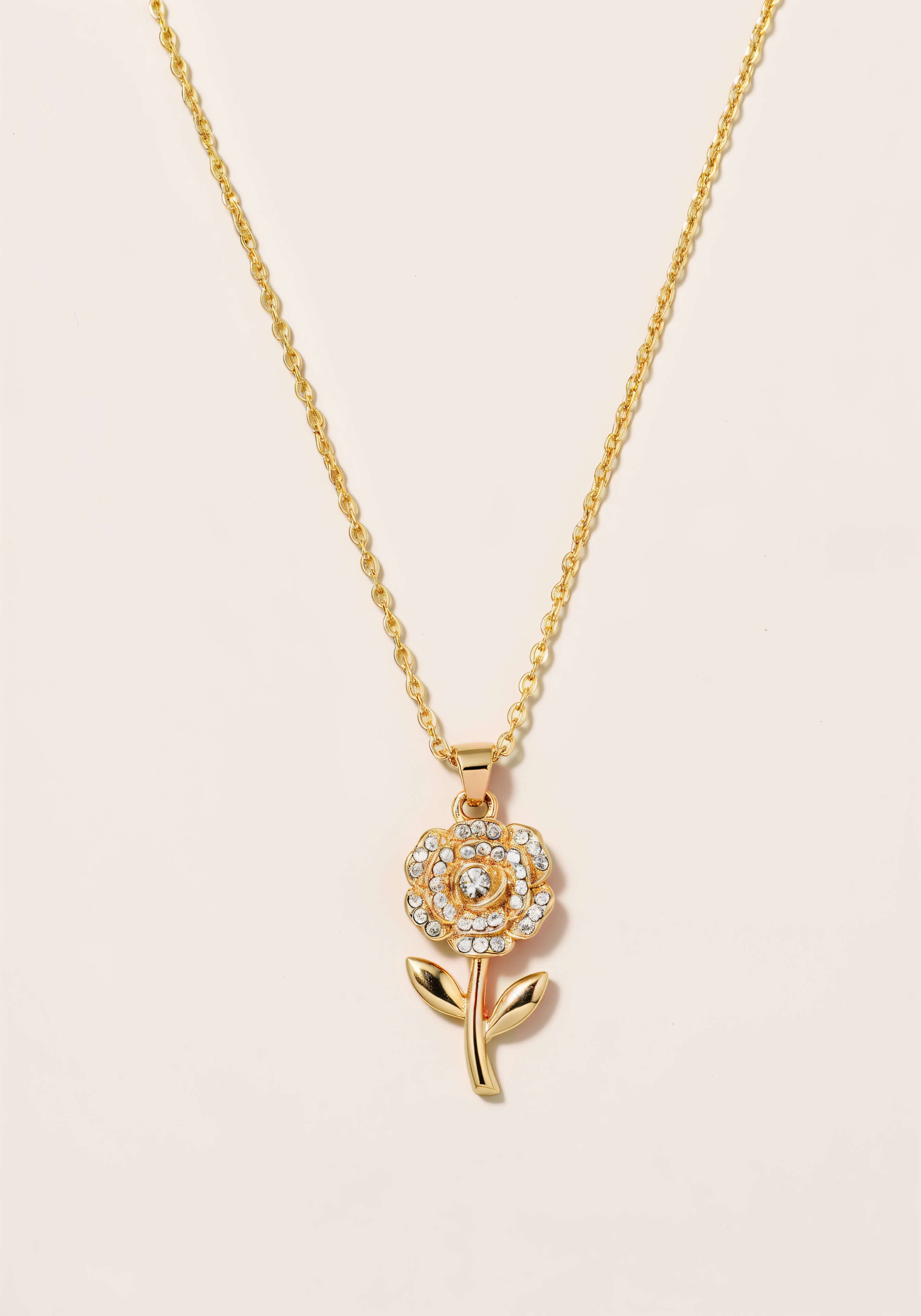 A gold necklace with a rose pendant, each petal is encrusted in mini-diamonds.